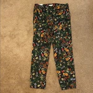 H&M black slacks w/ multicolor floral. Size 10.